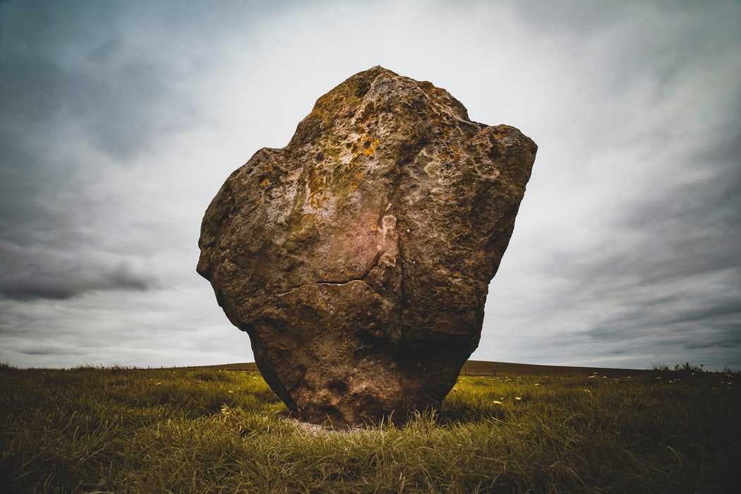 A lone rock in an empty field